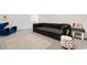Spacious living room with carpet and a comfortable L-shaped black couch at 534 Calhoun Falls Dr., Myrtle Beach, SC 29579