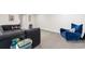 Spacious living room with carpet and a comfortable L-shaped couch and blue chair at 534 Calhoun Falls Dr., Myrtle Beach, SC 29579