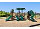 Community playground with multiple slides, climbing structures, and shaded areas at 534 Calhoun Falls Dr., Myrtle Beach, SC 29579