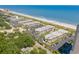 Aerial shot of the condo community near the beach, showcasing the parking and lush greenery at 5601 N Ocean Blvd. # B-314, Myrtle Beach, SC 29577