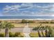 Stunning beach view from the property with palm trees, and well maintained path at 5601 N Ocean Blvd. # B-314, Myrtle Beach, SC 29577