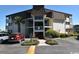 Condo building with a well-maintained lawn and mature trees in a coastal community at 5601 N Ocean Blvd. # B-314, Myrtle Beach, SC 29577