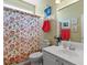 Bathroom featuring a floral shower curtain and decorative seashell accents at 5712 Whistling Duck Dr., North Myrtle Beach, SC 29582
