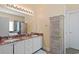 Bright bathroom featuring a double sink vanity with granite countertop and a spa tub at 5712 Whistling Duck Dr., North Myrtle Beach, SC 29582