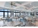 A dining room with lots of natural light, tables, and ceiling fans with ocean views at 5712 Whistling Duck Dr., North Myrtle Beach, SC 29582