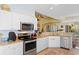 Well-equipped kitchen featuring white cabinets, stainless steel appliances, and granite countertops at 5712 Whistling Duck Dr., North Myrtle Beach, SC 29582