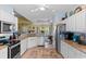 Spacious kitchen with stainless steel appliances, granite countertops and a seamless flow into the dining area at 5712 Whistling Duck Dr., North Myrtle Beach, SC 29582