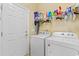 Laundry room with washer, dryer, shelving, and plenty of space at 5712 Whistling Duck Dr., North Myrtle Beach, SC 29582