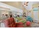 Open-concept living room flowing into the dining area, featuring comfortable seating and ample natural light at 5712 Whistling Duck Dr., North Myrtle Beach, SC 29582