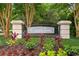 Entrance to Coquina Pointe shows a well-manicured landscape with a decorative sign at 5712 Whistling Duck Dr., North Myrtle Beach, SC 29582