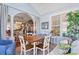 Inviting sunroom featuring a wooden table, comfortable seating, and large windows providing scenic views at 5712 Whistling Duck Dr., North Myrtle Beach, SC 29582