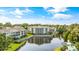 Serene aerial view of condos along the pond with fountain and lush foliage at 601 Hillside Dr. N # 3926, North Myrtle Beach, SC 29582