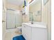Bathroom featuring striped wallpaper, white vanity with storage, toilet and glass shower with a showerhead at 601 Hillside Dr. N # 3926, North Myrtle Beach, SC 29582