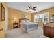 Bright bedroom with ceiling fan and a double bed, well-lit by natural light from the window at 601 Hillside Dr. N # 3926, North Myrtle Beach, SC 29582