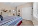 Bedroom with neutral walls, featuring a bed, natural light window and closet at 601 Hillside Dr. N # 3926, North Myrtle Beach, SC 29582