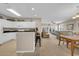 Open-concept kitchen with breakfast bar, white appliances, flowing to the living area and dining at 601 Hillside Dr. N # 3926, North Myrtle Beach, SC 29582