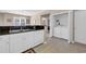 Well lit kitchen featuring stainless steel sink and appliances with a washer and dryer closet at 601 Hillside Dr. N # 3926, North Myrtle Beach, SC 29582