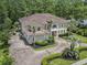 Gorgeous home showcasing lush landscaping, circular driveway, and a private backyard oasis at 664 Oxbow Dr., Myrtle Beach, SC 29579