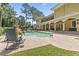 Spacious backyard features a pool with a waterslide, hot tub, and ample patio space at 664 Oxbow Dr., Myrtle Beach, SC 29579