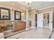 Spacious bathroom includes double vanities, granite countertops, decorative mirrors, and access to a toilet room at 664 Oxbow Dr., Myrtle Beach, SC 29579