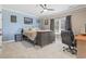 A modern bedroom including queen bed, dresser, desk, and a ceiling fan for optimal comfort at 664 Oxbow Dr., Myrtle Beach, SC 29579
