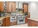 A well-equipped kitchen features granite countertops, stainless steel appliances, and wood cabinets at 664 Oxbow Dr., Myrtle Beach, SC 29579