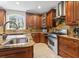 Modern kitchen with custom cabinets, granite countertops, and professional-grade stainless steel appliances at 664 Oxbow Dr., Myrtle Beach, SC 29579