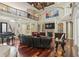 Bright living room with soaring ceilings, fireplace, hardwood floors, and piano at 664 Oxbow Dr., Myrtle Beach, SC 29579