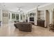 A spacious living room features tile flooring, a large window, and custom built-ins at 664 Oxbow Dr., Myrtle Beach, SC 29579