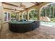 Covered outdoor patio with comfortable seating overlooking a pool with a waterslide at 664 Oxbow Dr., Myrtle Beach, SC 29579