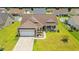 Stunning aerial view of a home with a manicured front lawn and a two-car garage at 716 Weston Dr., Conway, SC 29526