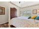 Bright bedroom with a four-poster bed, wood floors, and a view of the backyard at 716 Weston Dr., Conway, SC 29526