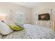 Cozy bedroom with wood floors, floral bedding, and natural light from the window at 716 Weston Dr., Conway, SC 29526