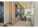 Charming front porch with rocking chairs and brick accents at 716 Weston Dr., Conway, SC 29526