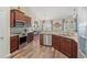 Well-equipped kitchen with granite countertops, stainless steel appliances, and hardwood floors at 716 Weston Dr., Conway, SC 29526