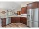 Modern kitchen with stainless steel appliances, granite countertops, and sleek wooden cabinets at 716 Weston Dr., Conway, SC 29526