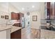 Functional kitchen featuring granite countertops, stainless steel appliances, and hardwood floors at 716 Weston Dr., Conway, SC 29526