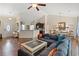 Bright living room featuring a ceiling fan, hardwood floors, comfortable seating and dining area at 716 Weston Dr., Conway, SC 29526