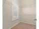 Simple walk-in closet with wire shelving and a window providing natural light at 716 Weston Dr., Conway, SC 29526