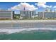 Stunning view of an oceanfront resort along a sandy beach with breaking waves and city views at 7200 N Ocean Blvd. # 459, Myrtle Beach, SC 29572