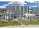 Stunning aerial view of a beachfront resort featuring multiple pools and well-manicured grounds at 7200 N Ocean Blvd. # 459, Myrtle Beach, SC 29572