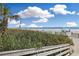 Wooden walkway leading to the beautiful beach with ocean views and sunny skies at 7200 N Ocean Blvd. # 459, Myrtle Beach, SC 29572