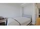 Minimalist bedroom with shiplap walls and a bed, creating a calming retreat at 7200 N Ocean Blvd. # 459, Myrtle Beach, SC 29572