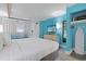 This bedroom has light blue walls, modern furniture, a closet space and a bright window at 7200 N Ocean Blvd. # 459, Myrtle Beach, SC 29572