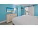 Inviting bedroom with bright blue walls, sleek furniture, and modern touches in an airy atmosphere at 7200 N Ocean Blvd. # 459, Myrtle Beach, SC 29572