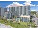 Large oceanfront resort featuring multiple pools, palm trees, and pristine sandy beach access at 7200 N Ocean Blvd. # 459, Myrtle Beach, SC 29572