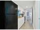 Clean kitchen with black appliances, white cabinets, and granite countertops at 7200 N Ocean Blvd. # 459, Myrtle Beach, SC 29572
