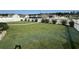 Well-manicured backyard with a white picket fence and a spacious green lawn at 8164 Forest Edge Dr., Myrtle Beach, SC 29579