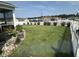 Beautiful backyard featuring a white picket fence, lush lawn, and landscaping at 8164 Forest Edge Dr., Myrtle Beach, SC 29579
