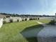 Expansive backyard with a stone paver walkway and a white picket fence at 8164 Forest Edge Dr., Myrtle Beach, SC 29579